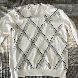 Lacoste v neck sweater . Beige w/ grey pattern. Size medium / 4